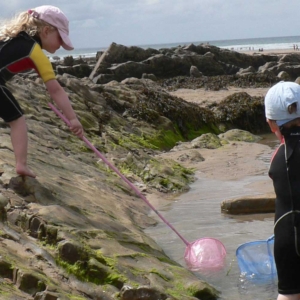 Playing in the Croyde Beach rock pools