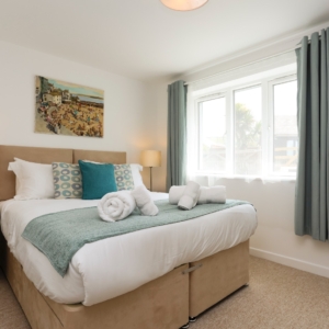 Bedroom 3 - on ground floor with kingsize bed, dressing table and wardrobe